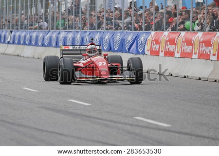 AARHUS, DENMARK - MAY 23 2015: Claus Bertelsen in a Ferrari model Jean Alesi formula one racing car from 1992, at the Classic Race Aarhus 2015