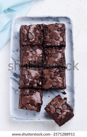 Similar – Image, Stock Photo eight pieces of chocolate cake in muffin tins