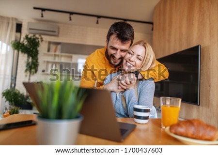 Similar – Image, Stock Photo Young happy couple staying at home with their baby son sitting on the living room floor.