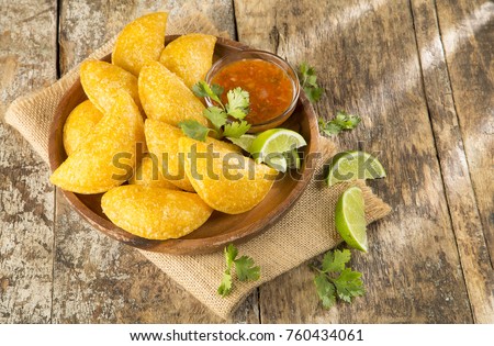 Colombian empanada with spicy sauce on wooden background Foto stock © 