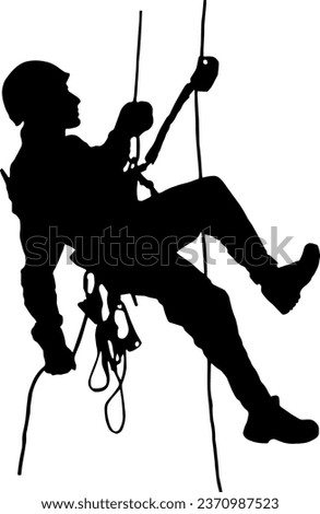 Rope access technician descending ropes