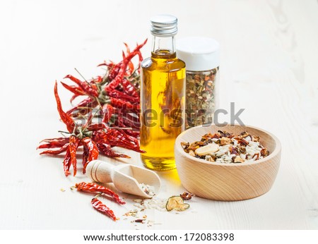 Mix of raw rice and dried vegetables in wooden bowl on a light background