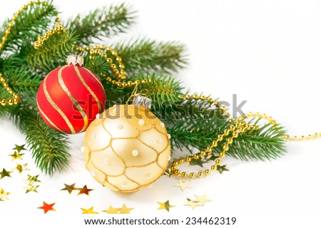 Red and Gold Christmas balls and green branch on white background