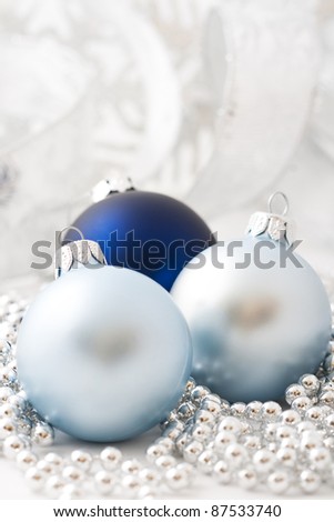 Blue and silver christmas balls on white background