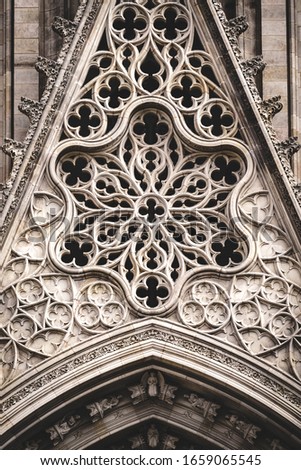 Similar – Image, Stock Photo Rose window and sculpted filigrees at the front of a gothic cathedral