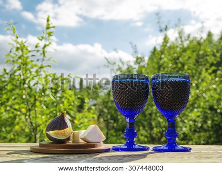 Still life concept - wine party outdoors. Two wine glasses.