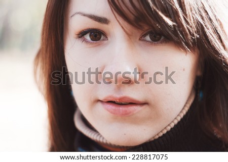 Close-up portrait of girl. Portrait of beautiful brunette. Penetrating eyes, open mouth