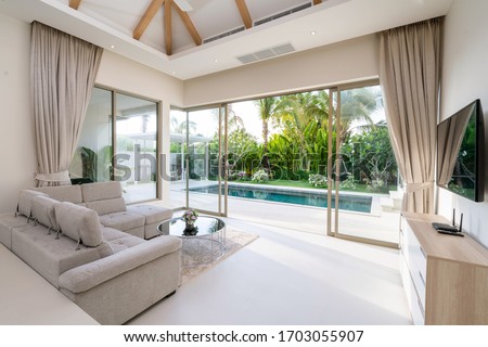 Interior and exterior design of living room with pool view in villa, house, home, condo and apartment