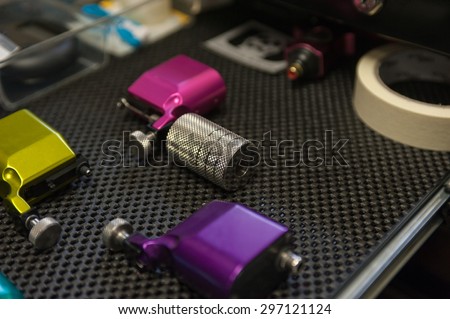 Various electromagnetic tattoo guns for different jobs.