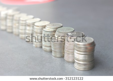 The roll of Thailand coins (bath), selective focus on the third roll from the front