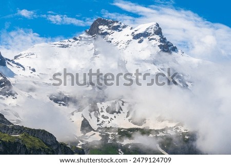 Similar – Foto Bild Schroffer Berggipfel eingehüllt in dunkle Wolken