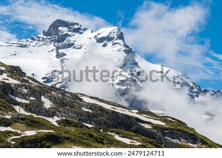 Similar – Foto Bild Schroffer Berggipfel eingehüllt in dunkle Wolken