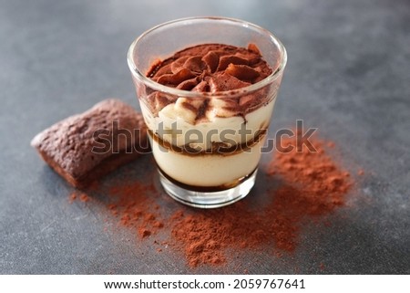 Tiramisu with chocolate pices, cocao powder and brownie. Photo stock © 