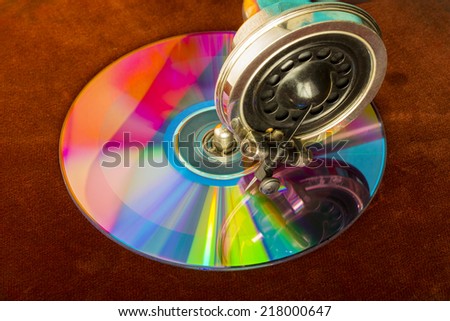 Colorful close up for a CD disk on a 30's vintage patefon turntable
