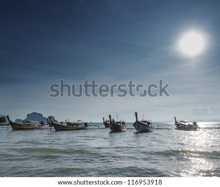 Beautiful dramatic sea landscape. Traditional asian long tail boats and scenery evening seascape background.