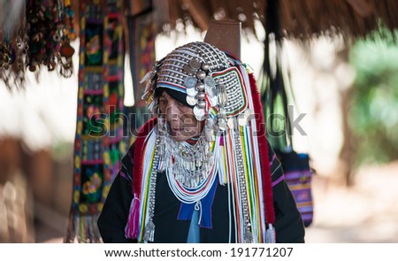 MAE HONG SON, CHIANG MAI, THAILAND - DEC 4, 2013: Unidentified Akha indigenous hill tribe woman in traditional clothes. Asian ethnic tribal group. Popular tourist travel destination in north Thailand