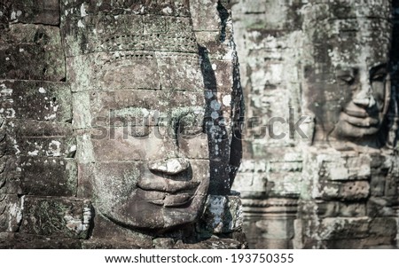 Angkor Wat Cambodia. Bayon temple in Angkor Thom historical place. Human face and figures murals and carvings
