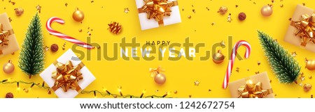 Happy New Year banner, Xmas sparkling lights garland with gifts box and golden tinsel. Horizontal Christmas posters, greeting cards, headers, website. Objects viewed from above. Flat lay, Top view