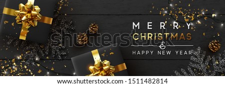 Christmas banner. Background Xmas design of sparkling lights garland, with realistic gifts box, black snowflake and glitter gold confetti. Horizontal christmas poster, greeting cards, headers, website