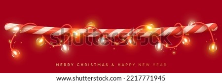Christmas decorative light garland is wound on line red candy stick. String border holiday decor for web poster banner. Realistic 3d design of bright glowing lights glass lamps. Vector illustration ストックフォト © 