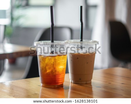 Similar – Image, Stock Photo two plastic cups with liquor stand on a wooden table