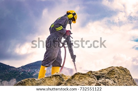 Similar – Image, Stock Photo Miner in the mine. Well-uniformed miner inside mine raising thumb