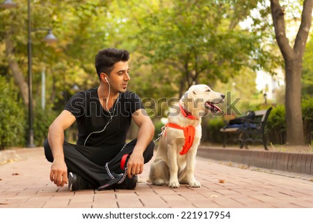 Young man with dog relaxed