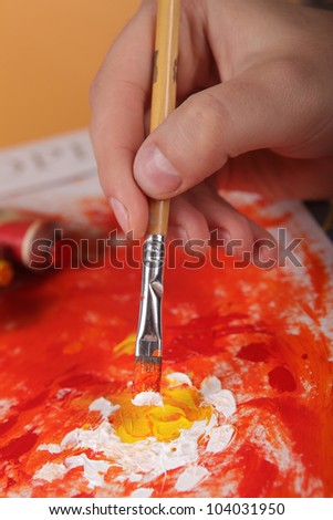 person draws oils
