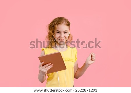 Similar – Image, Stock Photo A teenage girl does makeup and shows how to apply blush while recording video for her blog on her smartphone on a tripod at home