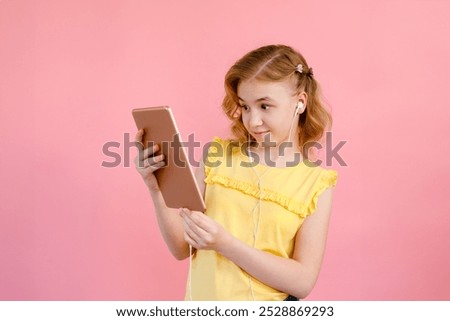 Similar – Image, Stock Photo A teenage girl does makeup and shows how to apply blush while recording video for her blog on her smartphone on a tripod at home