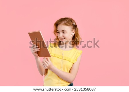 Similar – Image, Stock Photo A teenage girl does makeup and shows how to apply blush while recording video for her blog on her smartphone on a tripod at home