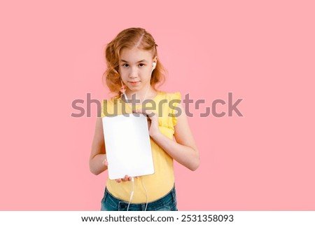 Similar – Image, Stock Photo A teenage girl does makeup and shows how to apply blush while recording video for her blog on her smartphone on a tripod at home