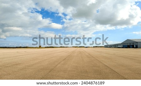 Similar – Image, Stock Photo Parking space management ::: five bicycles and a power bolt basking in the sun on a boring red brick wall