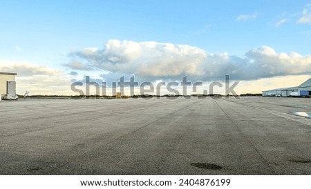 Image, Stock Photo Parking space management ::: five bicycles and a power bolt basking in the sun on a boring red brick wall