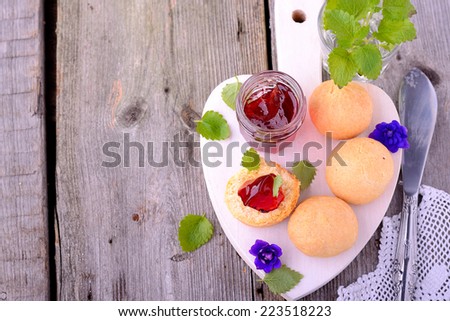 scone with strawberry jam, tea party , afternoon tea , buttermilk biscuits. Selective focus