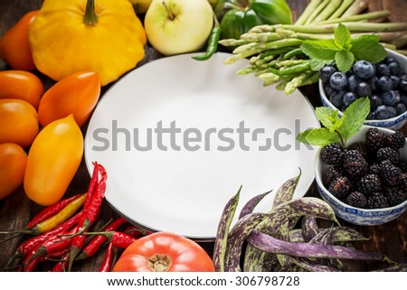 Colorful fresh vegetables of all colors on the wooden background. The concept of healthy nutrition efficiency. Selective focus. Top view
