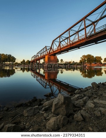 Similar – Foto Bild Stahlbruecke mit Spiegelung ueber Fluss