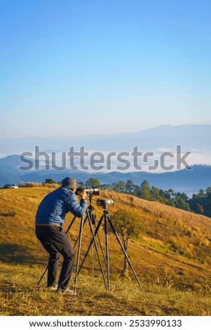 Similar – Image, Stock Photo Man takes a sunset photo on the phone