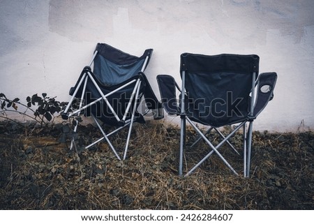 Image, Stock Photo two abandoned camping chairs with towel