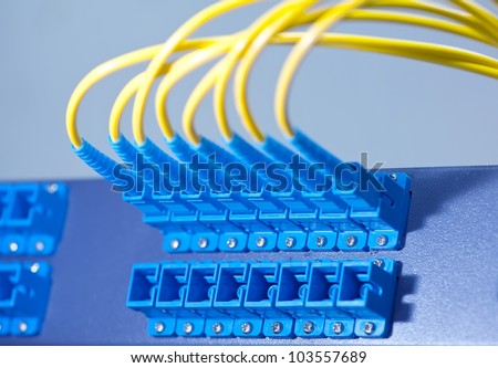 Panel of Fiber network switch with some yellow network cables