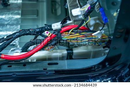 Large wide cable with wires and connectors and terminals in the wiring repair shop and electricians for connecting   Foto stock © 