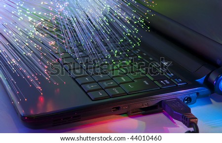 technology background, Bunch of green red fibre optics with keyboard