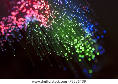 bunch of optical fibers flying from deep on technology background