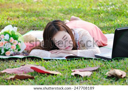 woman sleeping on wooden mat in relax time.