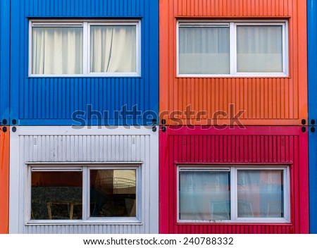 Container homes in red, white, orange and blue