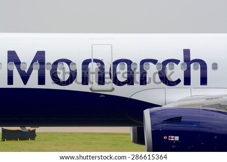 MANCHESTER, UK - SEPTEMBER 9, 2014 : Close up view taken of a Monarch jet aircraft logo / brand, at Manchester airport, Uk