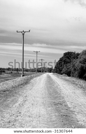 A countryside road converted to black and white
