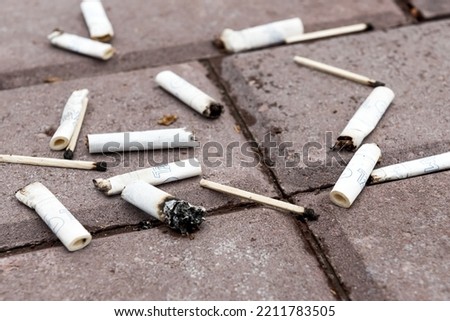 Similar – Image, Stock Photo Filter cigarette lies on a wooden table