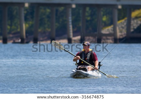 CARY, NORTH CAROLINA - SEPT 13: Retired man readies for a day of fishing and kayaking on 13 Sept 2015 at Lake Jordan