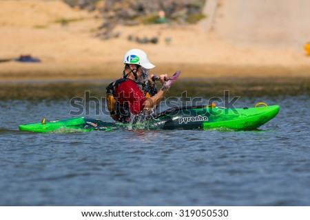 CARY, NORTH CAROLINA - SEPT 20: Retired man practicing whitewater kayak recoveries 20 Sept 2015 at Lake Jordan